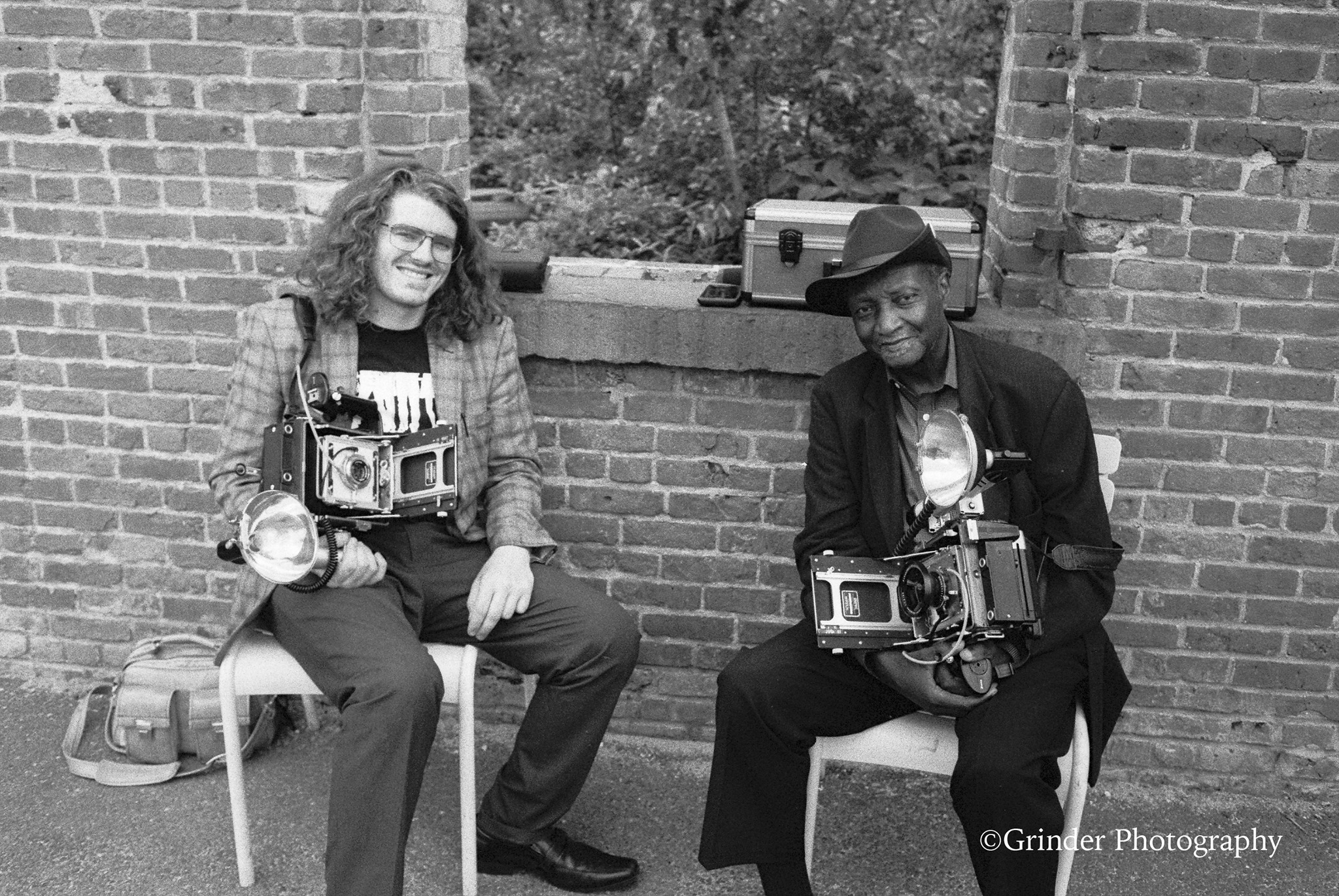 Taylor Sperring and Louis Mendes with their Crown Graphic press cameras in DUMBO, Brooklyn, July 2019